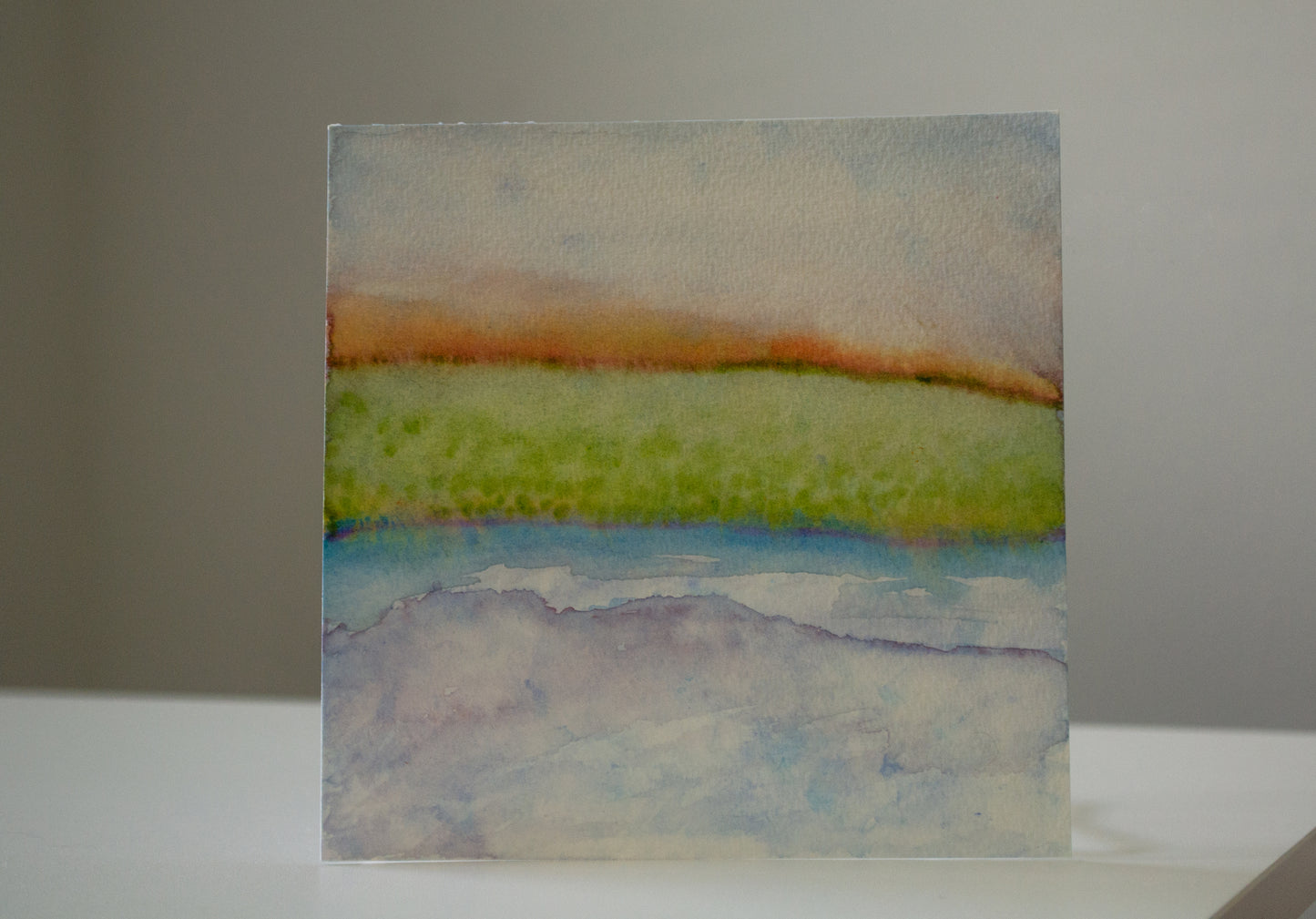 Abstract watercolor painting on a plain background