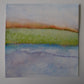 Watercolor painting of a landscape with green field and blue water on a gray background